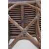 Ovaler Rattanhocker mit grauem Kissen